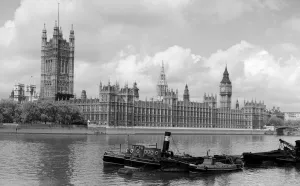 Boats on the River Thames at Houses of Parliament Building, London, England, UK Boats on the River Thames at Houses of Parliament Building, London, England, UK