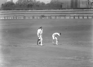 Bowling against his own University. E R T Holmes, the former Oxford captain bowling Bowling against his own University. E R T Holmes, the former Oxford captain bowling