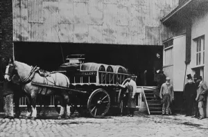 Brewery workers with a brewers dray take a break from work for a portrait at the Brewery workers with a brewers dray take a break from work for a portrait at the