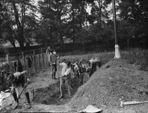 The Bridgen scouts build their own headquarters. Boys digging the sewer foundation The Bridgen scouts build their own headquarters. Boys digging the sewer foundation