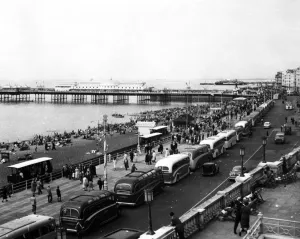 Brighton Coaches line the front and crowds are out on beach and promenade 1st Brighton Coaches line the front and crowds are out on beach and promenade 1st