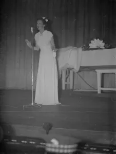 British actress, Jessie Matthews singing on stage at the opening of the Granada British actress, Jessie Matthews singing on stage at the opening of the Granada
