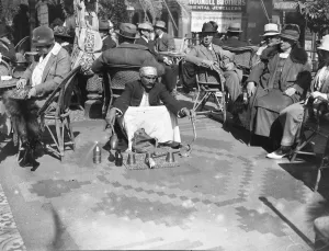 The Cairo Season. The native conjurer entertaining guests on the terrace at the The Cairo Season. The native conjurer entertaining guests on the terrace at the