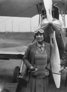 Captain Lancaster and Mrs Miller start on flight to Australia. Mrs Miller in front Captain Lancaster and Mrs Miller start on flight to Australia. Mrs Miller in front