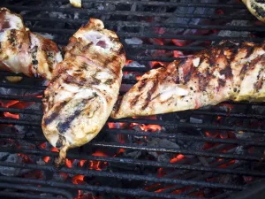Chicken fillets wrapped in parma ham on the barbecue credit: Marie-Louise Avery Chicken fillets wrapped in parma ham on the barbecue credit: Marie-Louise Avery