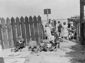 Children have come to the riverside on the Thames estuary at Gravesend, Kent, to Children have come to the riverside on the Thames estuary at Gravesend, Kent, to