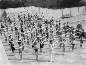 Children performing drills at the Swanscombe Baths in Kent. The instructor is Mr Children performing drills at the Swanscombe Baths in Kent. The instructor is Mr