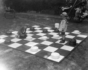 Children play giant draughts in Devonshire Park, Eastbourne, Sussex. 21 June 1920 Children play giant draughts in Devonshire Park, Eastbourne, Sussex. 21 June 1920