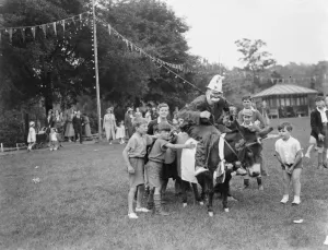 A clown rides a donkey at the Dartford Carnival in Kent. 1937 A clown rides a donkey at the Dartford Carnival in Kent. 1937