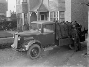 Coal delivery by one of the coal vans from H Salmon, Coal and Coke Merchants in Coal delivery by one of the coal vans from H Salmon, Coal and Coke Merchants in