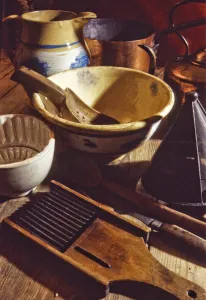 A collection of old and antique kitchenalia, tools and equipment including jugs, bowls A collection of old and antique kitchenalia, tools and equipment including jugs, bowls