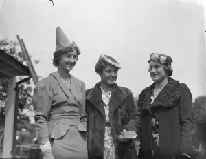Contrasting hat fashions at free Wimbledon reception. Three of the original Contrasting hat fashions at free Wimbledon reception. Three of the original