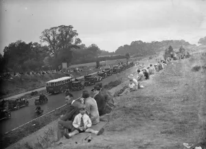 Crowds watching the traffic on the newly opened Sicup by - pass. The road greatly Crowds watching the traffic on the newly opened Sicup by - pass. The road greatly