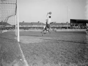 Dartford football club versus Guilford football club. The goal keeper and an attacker Dartford football club versus Guilford football club. The goal keeper and an attacker