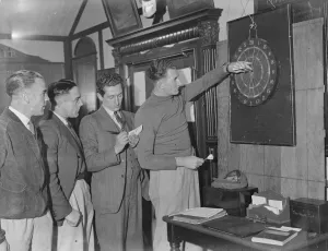 Darts, a pastime indulged in by members of the Arsenal Football Club when in training Darts, a pastime indulged in by members of the Arsenal Football Club when in training