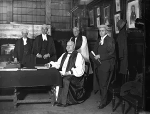 Dr F T Woods, the newly appointed Bishop of Winchester, signing his consent to Dr F T Woods, the newly appointed Bishop of Winchester, signing his consent to