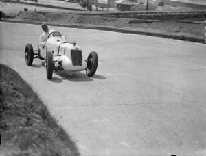 Driver, W Esplen in his supercharged MG taking the last hill on the new road track at Brooklands Driver, W Esplen in his supercharged MG taking the last hill on the new road track at Brooklands