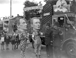 Eltham Carnival in Kent. Policemen talking with the Big Heads. 1934 Eltham Carnival in Kent. Policemen talking with the Big Heads. 1934