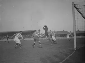 Football match - Dartford versus Colchester. The goalie makes a save Football match - Dartford versus Colchester. The goalie makes a save