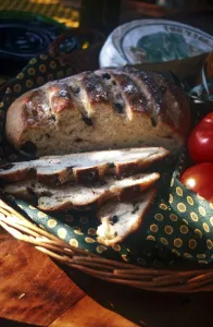 French olive bread with tomatoes and cheese in basket in gentle warmth of spring French olive bread with tomatoes and cheese in basket in gentle warmth of spring