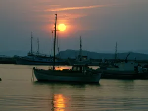 Greek island - Mykonos sunset and boats 2006 Charles Walker / TopFoto Greek island - Mykonos sunset and boats 2006 Charles Walker / TopFoto