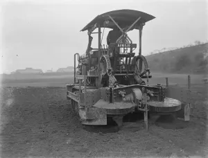 A Gyrotiller ( diesel rotary plough ) at work in a field. 1935 A Gyrotiller ( diesel rotary plough ) at work in a field. 1935