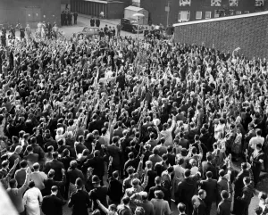 Hands shoot into the air to signify assent by St. Pancras tenants to the resolution Hands shoot into the air to signify assent by St. Pancras tenants to the resolution