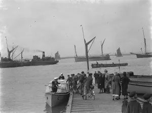 The Home Fleet on the river Thames at Greenhithe, Kent. School children board a The Home Fleet on the river Thames at Greenhithe, Kent. School children board a