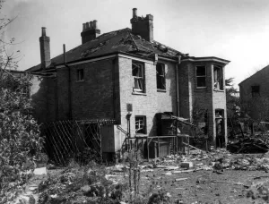A house in the Bexley area, showing considerable damage, surrounded by debris after A house in the Bexley area, showing considerable damage, surrounded by debris after