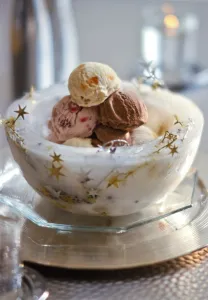 Ice bowl with stars holding balls of mixed icecreams for Christmas party credit Ice bowl with stars holding balls of mixed icecreams for Christmas party credit
