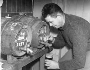 The landlord pours a beer at The Royal Oak Inn, High Hurstwood near Uckfield, Sussex The landlord pours a beer at The Royal Oak Inn, High Hurstwood near Uckfield, Sussex