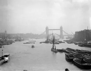 London. River Thames with barges and boats with the Tower Bridge in the back London. River Thames with barges and boats with the Tower Bridge in the back