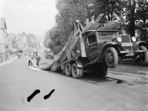 A lorry tips backwards, spilling its load in Sevenoaks, Kent. 1935 A lorry tips backwards, spilling its load in Sevenoaks, Kent. 1935