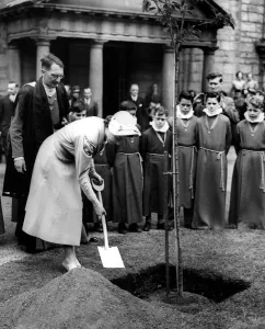 Her Majesty Queen Elizabeth II planting a tree in Canongate Kirk to mark her visit Her Majesty Queen Elizabeth II planting a tree in Canongate Kirk to mark her visit