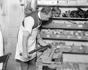 Making of wooden shoe lasts ( W. H. Smith, Sloane Street ). Knifing and shaping Making of wooden shoe lasts ( W. H. Smith, Sloane Street ). Knifing and shaping