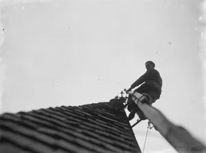 Man working up on the steeple of North Cray Church, Kent. 1936 Man working up on the steeple of North Cray Church, Kent. 1936