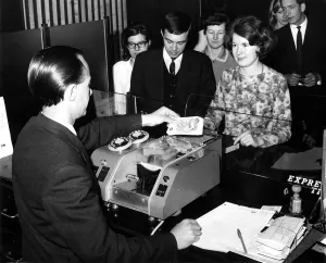 May 1st 1967 Bank teller Mr William Treacy loading pound notes into the machine May 1st 1967 Bank teller Mr William Treacy loading pound notes into the machine