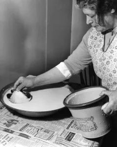 Miss Peggy Macleod making butter Skimming off the cream from thee cream pans Miss Peggy Macleod making butter Skimming off the cream from thee cream pans