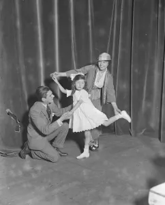 Miss Teddie Gerrard and Mr Harry Pilcer teaching Gwennie Seabrook to dance dance Miss Teddie Gerrard and Mr Harry Pilcer teaching Gwennie Seabrook to dance dance