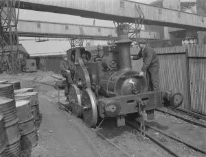Mr F Tremain and Mr A Shoveller operating an old locomotive in Erith , London . 1939 Mr F Tremain and Mr A Shoveller operating an old locomotive in Erith , London . 1939