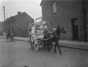 Nurses from the Livingstone Hospital parade through the street on a donkey cart as Nurses from the Livingstone Hospital parade through the street on a donkey cart as