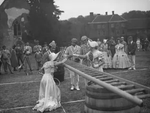 A period lawn tennis match at Lullingstone Park near Eynsford, Kent A period lawn tennis match at Lullingstone Park near Eynsford, Kent