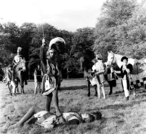 Rehearsing Medieval Jousting A victorius knight stands over his opponent during Rehearsing Medieval Jousting A victorius knight stands over his opponent during