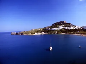 Rhodes - Lindos Lindos is a town and an archaeological site on the east coast of Rhodes - Lindos Lindos is a town and an archaeological site on the east coast of