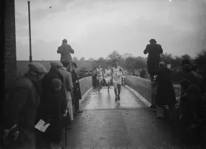 Runners crossing the bridge during the Oxford University versus Cambridge University Runners crossing the bridge during the Oxford University versus Cambridge University