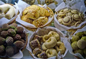 Selection of cakes, cookies and biscuits in display case of patisserie cafe in resort Selection of cakes, cookies and biscuits in display case of patisserie cafe in resort