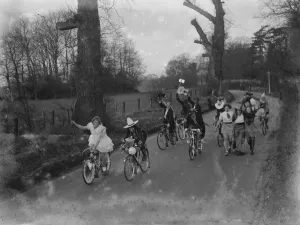 Sidcup Touring Clubs : fancy dress. Riding bicycles down the road Sidcup Touring Clubs : fancy dress. Riding bicycles down the road