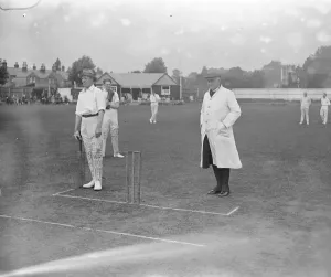 Slough Police versus Clergy Cricket Match The Bishop of Buckingham umpiring, batsmen Slough Police versus Clergy Cricket Match The Bishop of Buckingham umpiring, batsmen