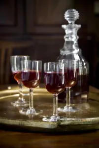 A tray of glasses of sloe gin with unstoppered decanter. credit: Marie-Louise Avery A tray of glasses of sloe gin with unstoppered decanter. credit: Marie-Louise Avery