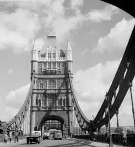 Vehicles and pedestians making their way across Tower Bridge over the River Thames Vehicles and pedestians making their way across Tower Bridge over the River Thames